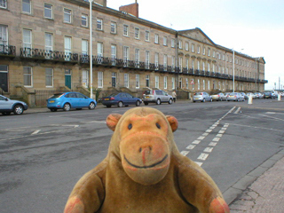 Mr Monkey looking across the road at Queens Terrace