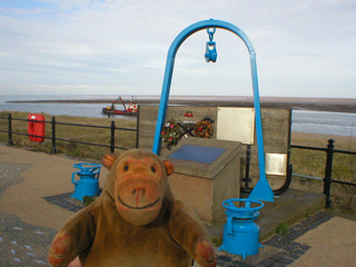 Mr Monkey looking at the Fleetwood Fisherman's memorial