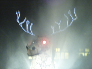 The head of the Beast of Blackpool surrounded by smoke