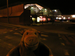 Mr Monkey outside Blackpool Station at night