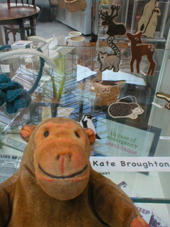Mr Monkey looking at animal badges by Kate Broughton