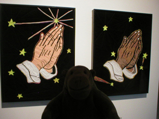 Mr Monkey looking at the hands panels of Holy Ghost