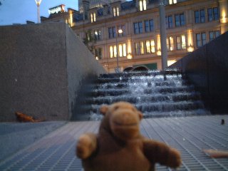 Mr Monkey with waterfall behind him