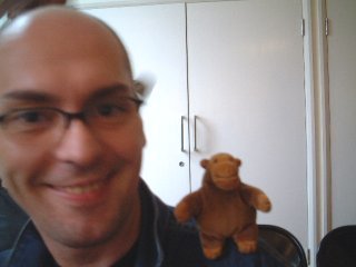 Mr Monkey on a bookseller's shoulder