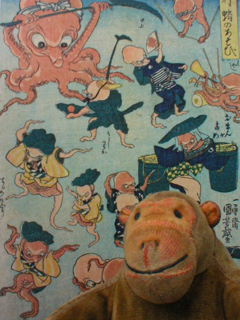 Mr Monkey in front of Fashionable Octopus Games from the exhibition catalogue