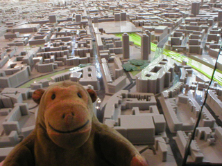 Mr Monkey looking at the model of London from the north