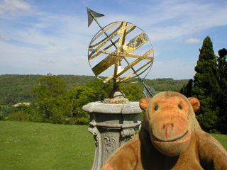 Mr Monkey looking at an armillary sphere