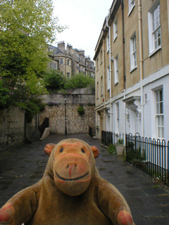 Mr Monkey walking along Miles's Buildings