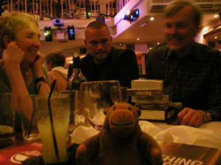 Mr Monkey with half of the winning quiz team (Ann Cleeves, Rafe McGregor and Martin Edwards)