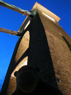 Mr Monkey looking up at the east pier of the bridge