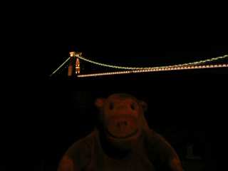 Mr Monkey looking at the Clifton Suspension bridge  from the viewpoint