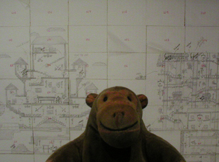 Mr Monkey examining the designer's maps for Fantasy World Dizzy