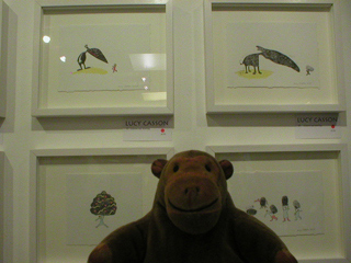 Mr Monkey looking at prints by Lucy Casson
