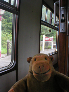 Mr Monkey looking out of the carriage at Darley Dale station
