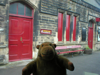 Mr Monkey looking at Darley Dale platform buildings