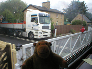 Mr Monkey looking at a truck waiting at the Darley Dale level crossing