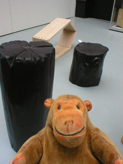 Mr Monkey looking at Audrey Hayes's scorched wood stools