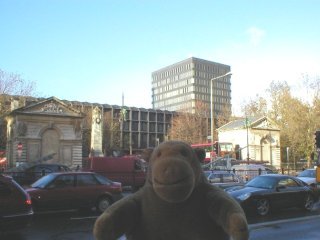 Mr Monkey with Euston station behind him