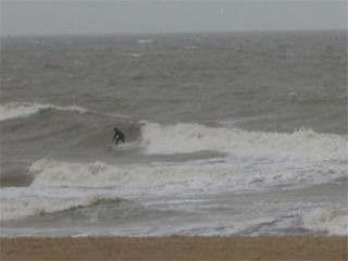 A surfer in the waves at Ostende