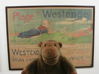 Mr Monkey looking at the 1897 poster Plage de Westende