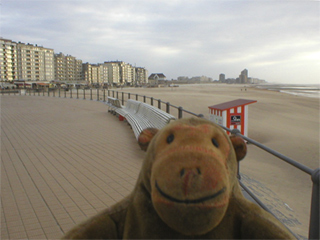 Mr Monkey looking along Ostende beach from the promenade