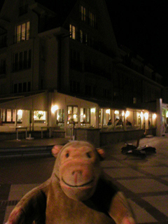 Mr Monkey outside the Mano tearooms at night