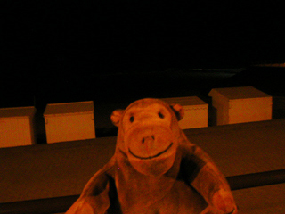 Mr Monkey looking at the beach huts at Westende