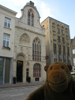 Mr Monkey crossing the street to the Frietmuseum
