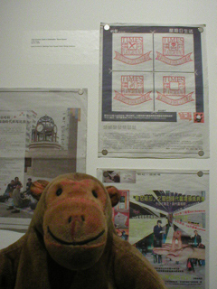 Mr Monkey looking at Ming Pao newspapers