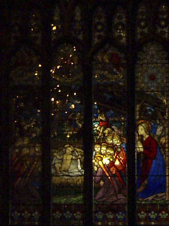 The Nativity window in Chester Cathedral lit from inside