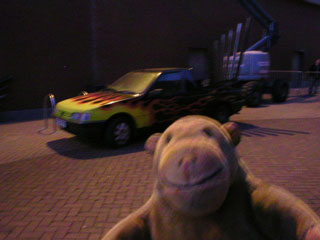 Mr Monkey looking at the non-functioning Superchoon car