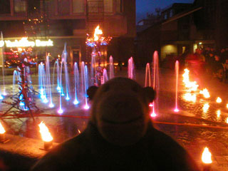 Mr Monkey watching flames and coloured fountains at St John's