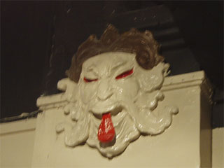 A 'Chinese' mask on the wall of Chinatown