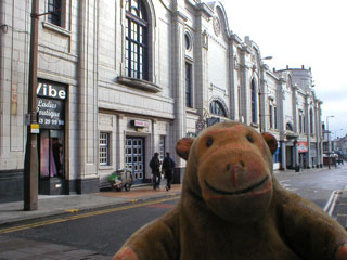 Mr Monkey looking at the Coronation Street frontage of the Winter Gardens
