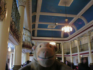Mr Monkey looking at the ceiling of the old Opera House lobby