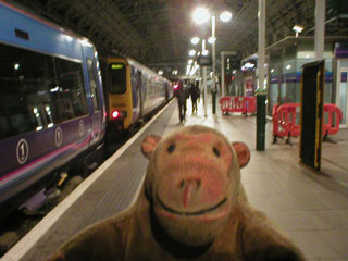 Mr Monkey trotting for a train at Piccadilly station