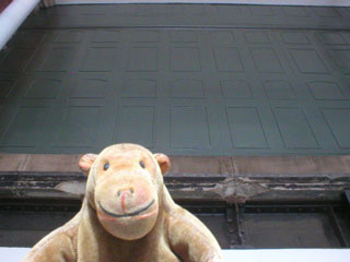 Mr Monkey looking up at one of the old water tanks