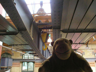 Mr Monkey looking at the lifting gear in the roof space of the Engine House