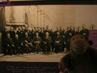 Mr Monkey looking at a photograph of the first Labour MPs