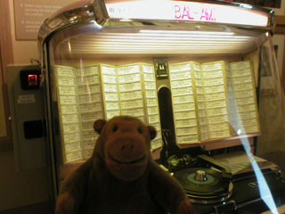 Mr Monkey listening to an old juke box