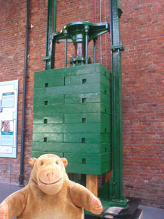 Mr Monkey looking at the accumulator piston and weights