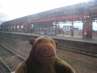 Mr Monkey looking at Wakefield Kirkgate station as the train sets off again