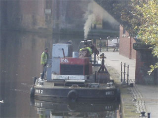 A dredging pontoon in Castlefield Basin