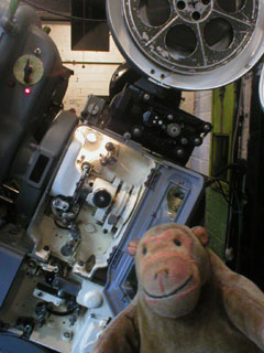 Mr Monkey looking at an opened up 1948 Westar projector