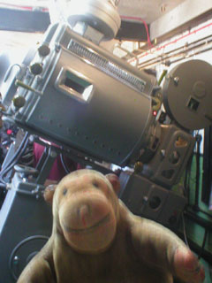 Mr Monkey looking at a closed 1948 Westar projector
