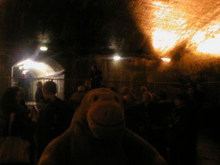 Mr Monkey listening to Ed the guide in the central hall of the air raid shelter