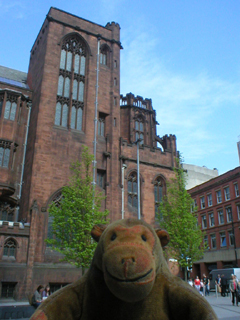 Mr Monkey looking at the side of the John Rylands Library