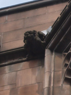 A gargoyle on the side of the John Rylands Library