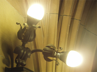 A light fitting on the cloister wall