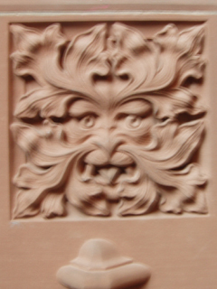 A carved Green Man on the archway into the Reading Room